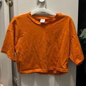TNA bright orange cropped tee